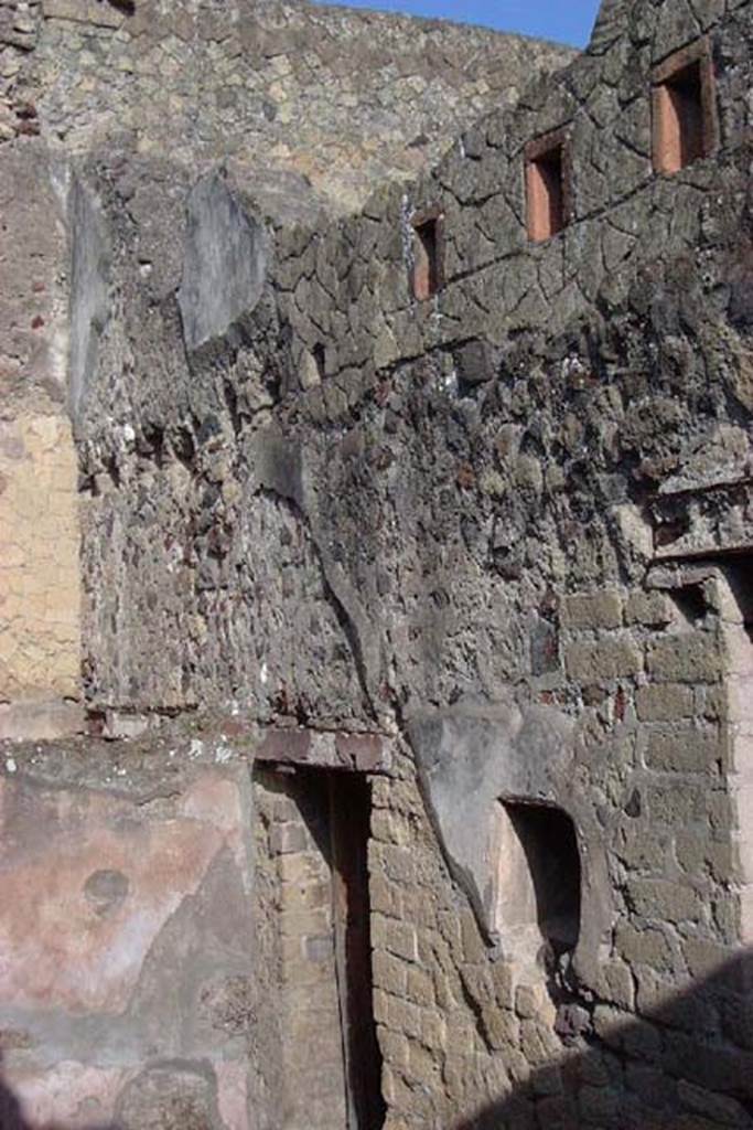 IV.18, Herculaneum, July 2001. 
Room 9, east wall at north end, with doorway and small window leading into bar-room of IV.17. 
Photo courtesy of Nicolas Monteix.
