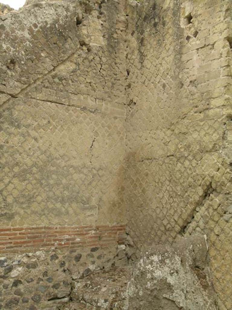 IV.19, Herculaneum, June 2005. Upper south-west corner. Photo courtesy of Nicolas Monteix.
In the upper left is the line of the stairs from the stairs discovered at IV.20, to an upper floor.
On the right is the line of the wooden stairs that would have gone up from the stone base of stairs to the mezzanine level.

