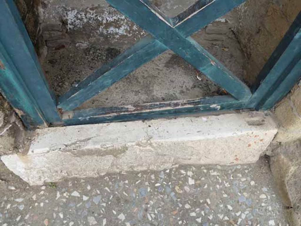 V.2, Herculaneum. May 2010. Detail of threshold of doorway to steps to upper floor.