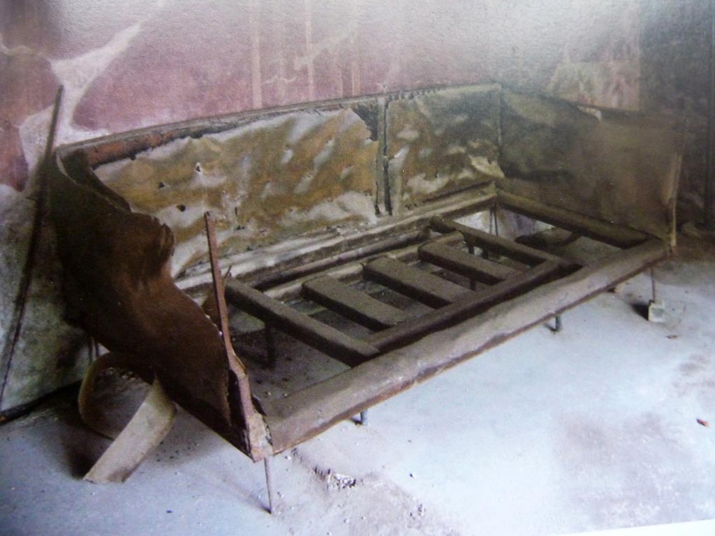 V.5 Herculaneum. Room 8, carbonised wooden bed in situ in room with three windows. 
Photo with kind permission of Prof. Andrew Wallace-Hadrill.
See Wallace-Hadrill, A. (2011). Herculaneum, Past and Future. London, Frances Lincoln Ltd., (p.216/217)
