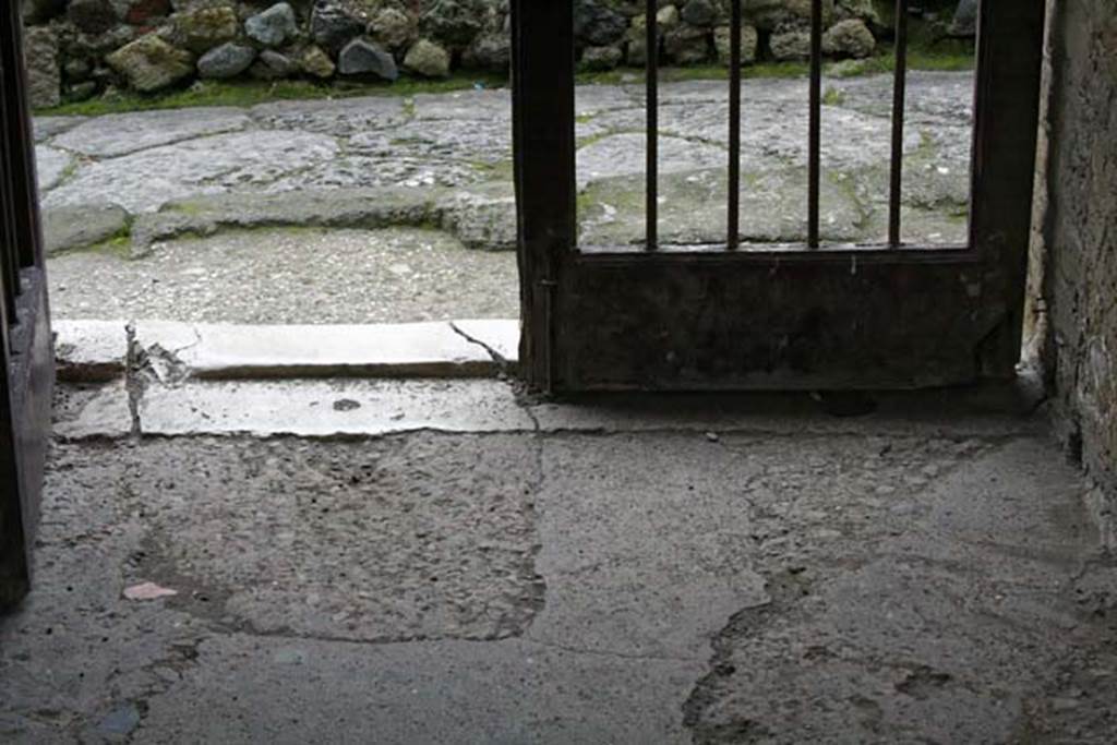 V.7, Herculaneum. February 2007. Looking west towards entrance doorway threshold, and Cardo IV.  Photo courtesy of Nicolas Monteix.
