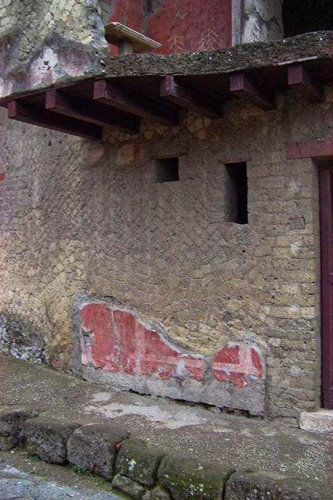 A stone building that has a sign on a brick wall

Description generated with very high confidence