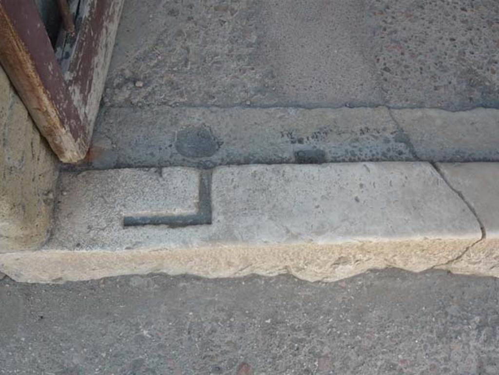 Ins.V.7, Herculaneum. August 2013.  Doorway threshold. Photo courtesy of Buzz Ferebee.