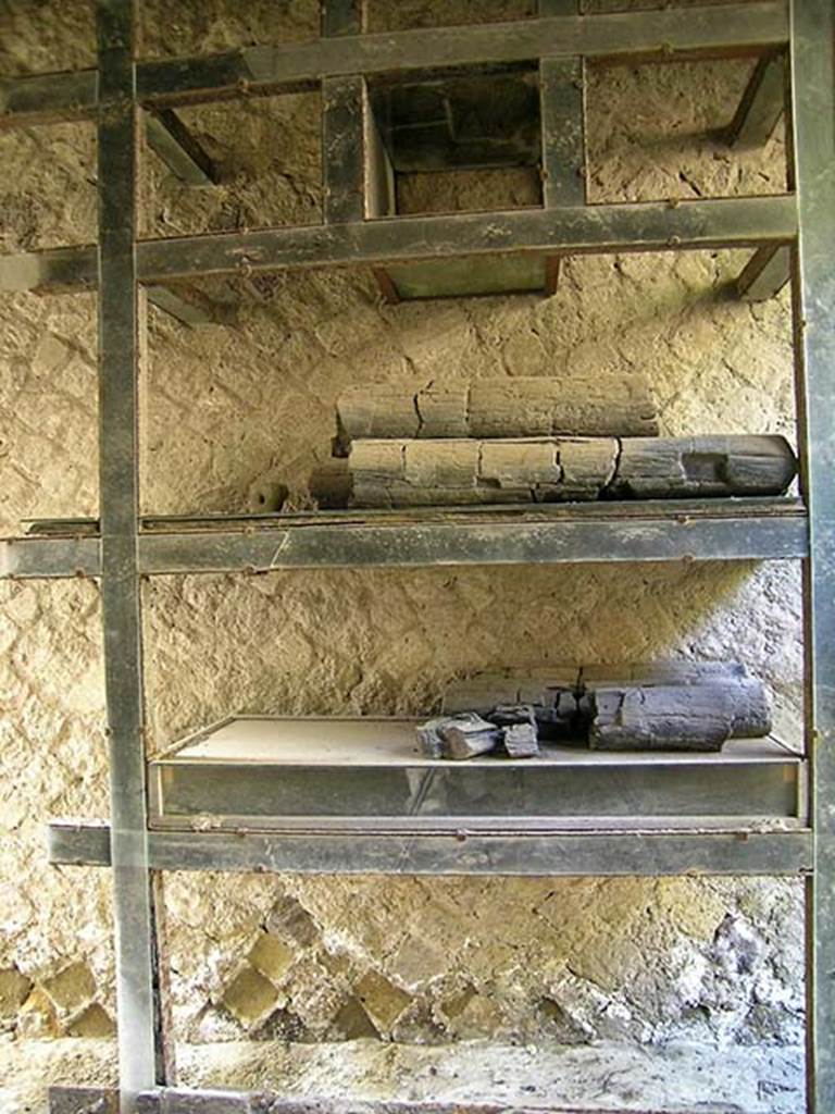 V.12, Herculaneum. May 2004. Looking towards west wall of shop-room. 
Photo courtesy of Nicolas Monteix.

