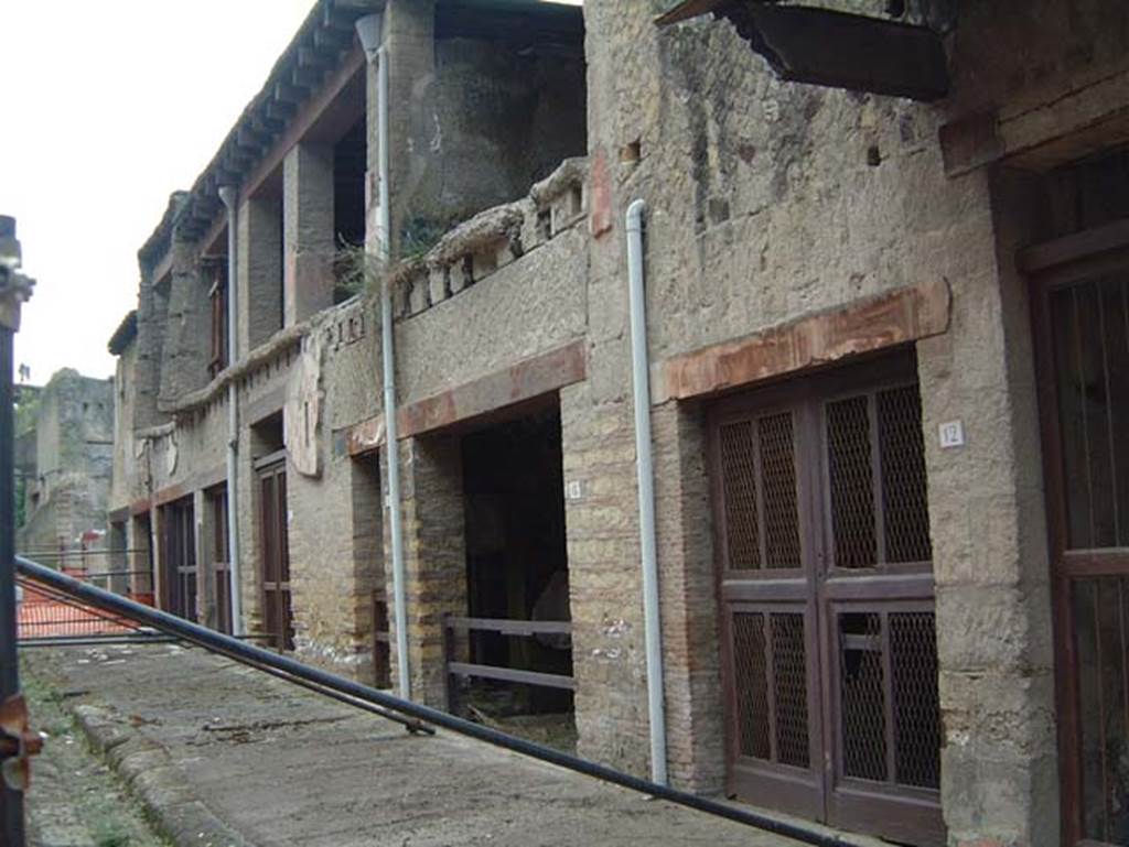 V.12 Herculaneum, on right. May 2001. Looking east along north end of insula. Photo courtesy of Current Archaeology.