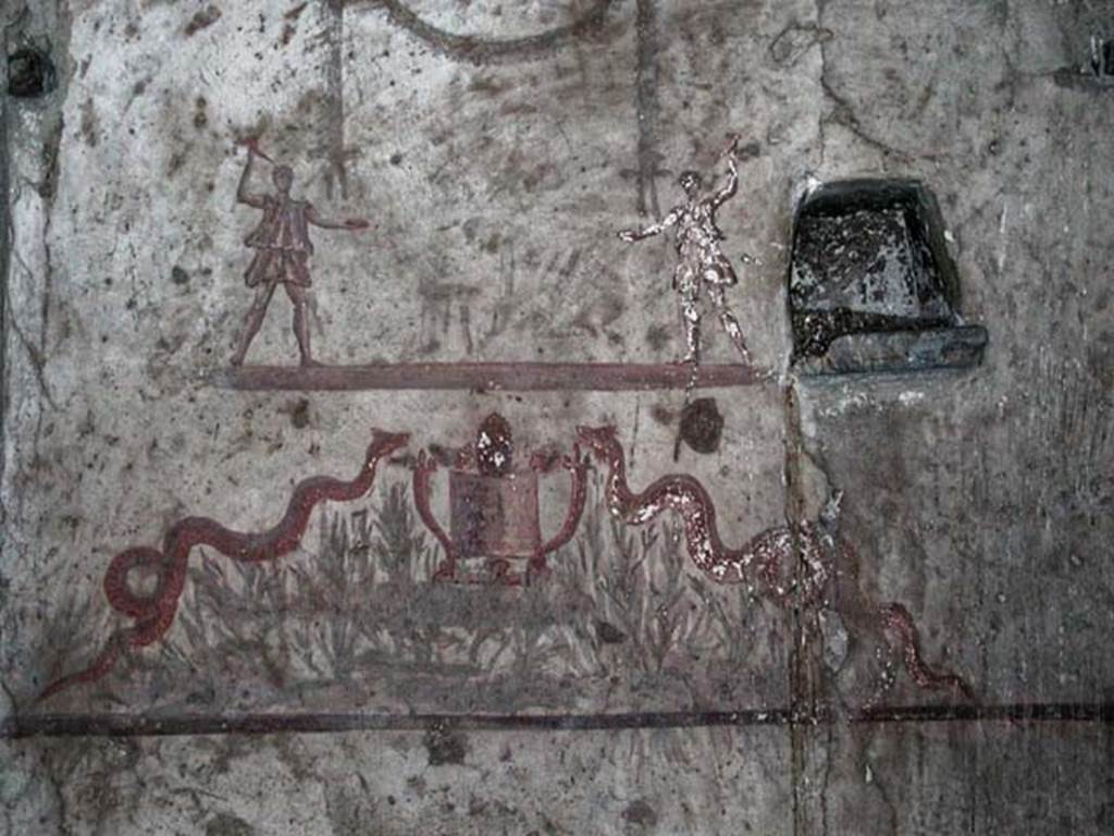 V.14, Herculaneum. September 2003. Detail of lararium on south wall of apartment. 
Photo courtesy of Nicolas Monteix.
