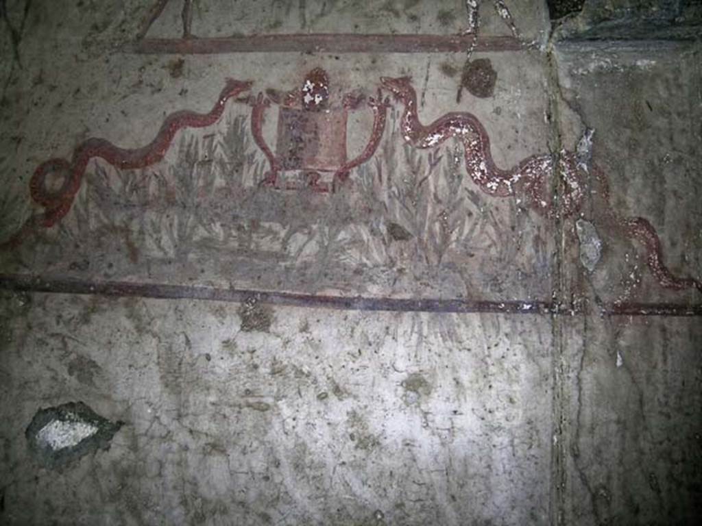 V.14, Herculaneum. May 2004. Detail of lower part of lararium on south wall of apartment. 
Photo courtesy of Nicolas Monteix.
