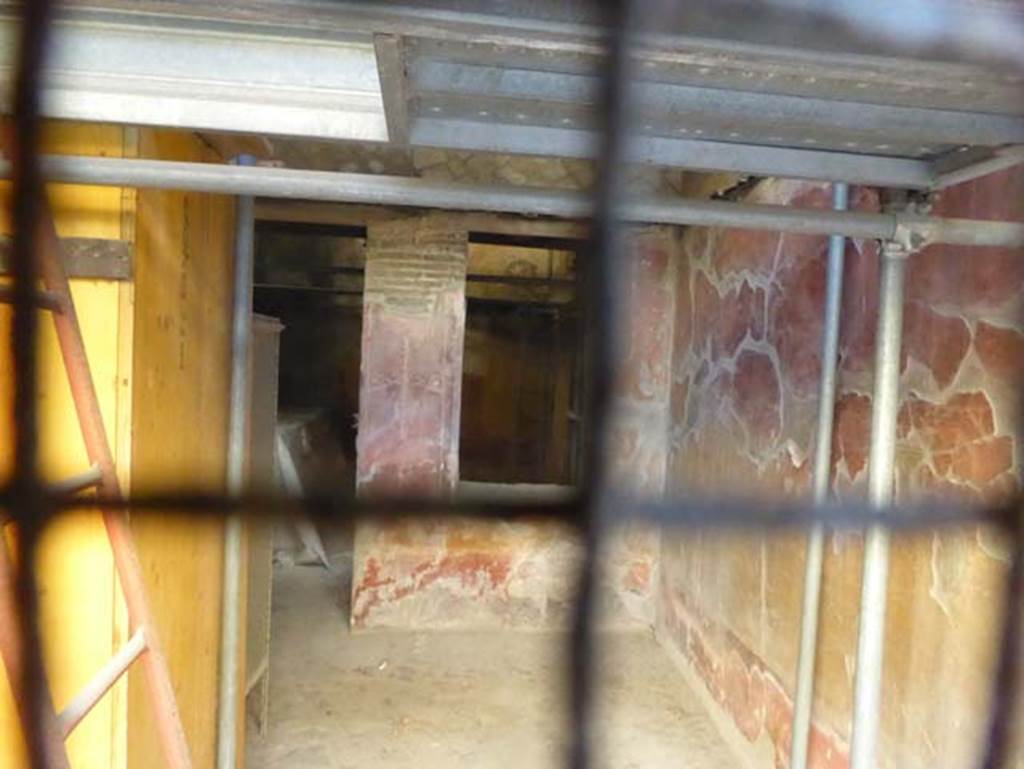 V.17, Herculaneum, September 2015. Looking towards south-west corner of shop-room, and remains of the painted walls.