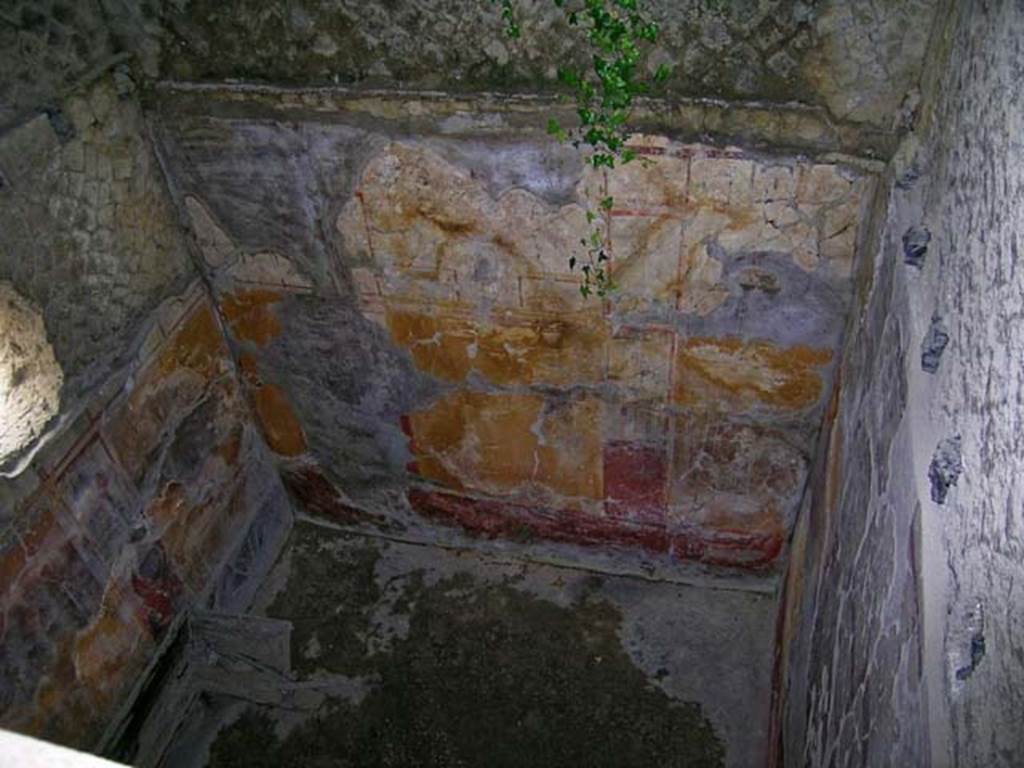 V.17, Herculaneum. May 2004. Looking down on rear room of shop, looking south from room 18, on upper floor, without a floor.
Photo courtesy of Nicolas Monteix.

