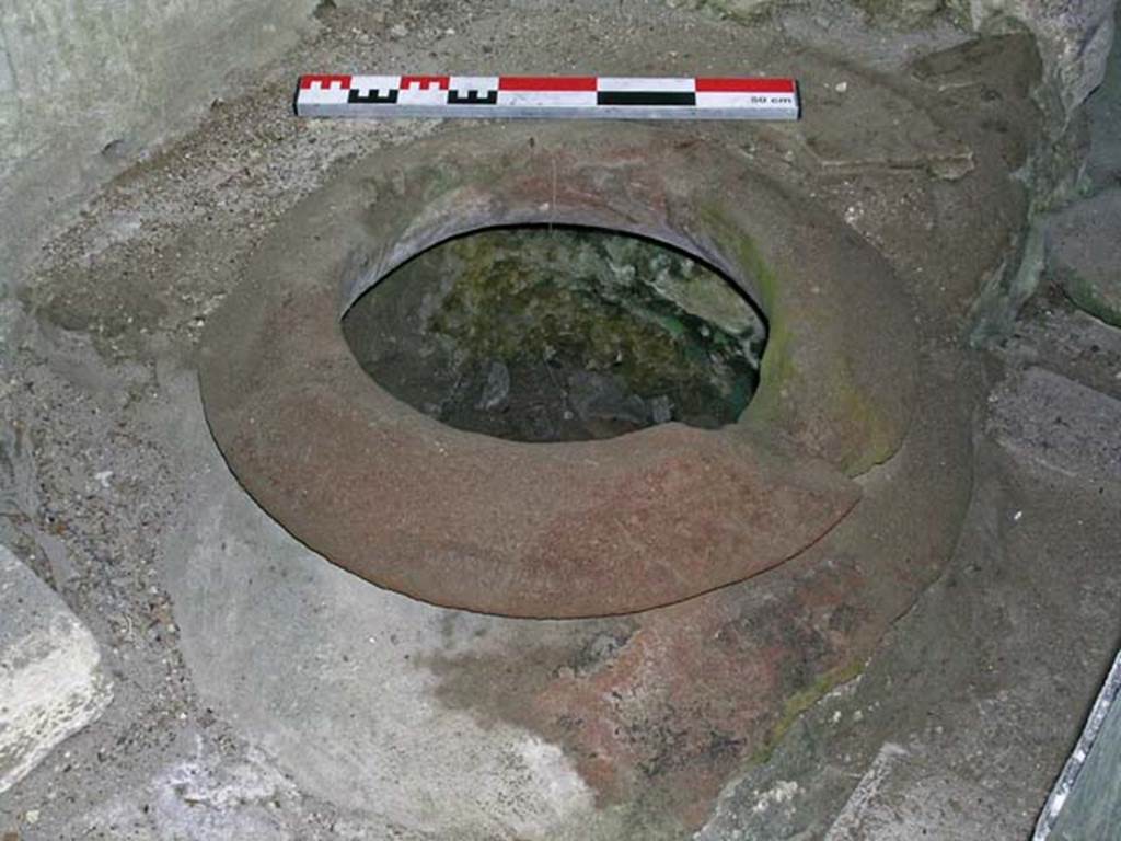 V.17-18, Herculaneum. May 2006. Dolium embedded in the flooring beneath the stairs.
Photo courtesy of Nicolas Monteix.
