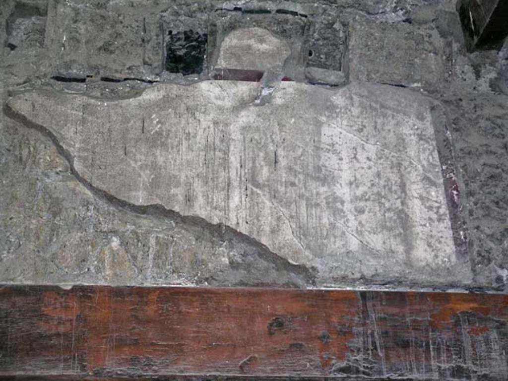 V.17, Herculaneum. May 2004. Looking towards upper north wall of shop-room, above doorway. Photo courtesy of Nicolas Monteix.
