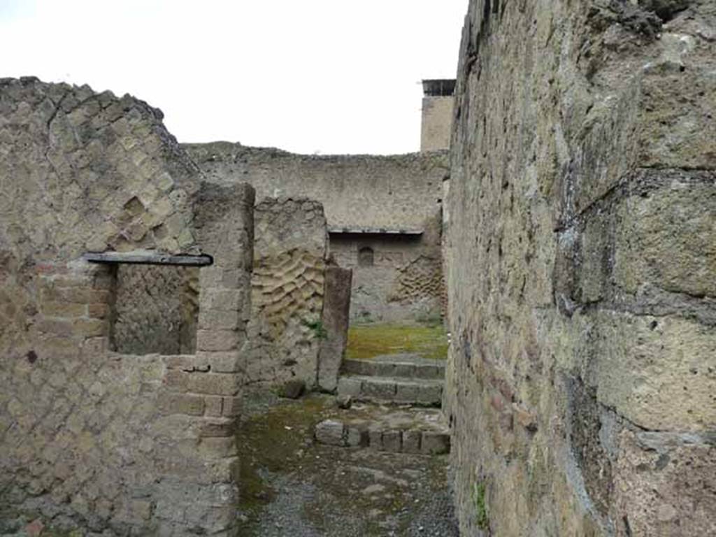 V.24, Herculaneum. May 2010. Looking west along entrance corridor, with two small rooms on south side.