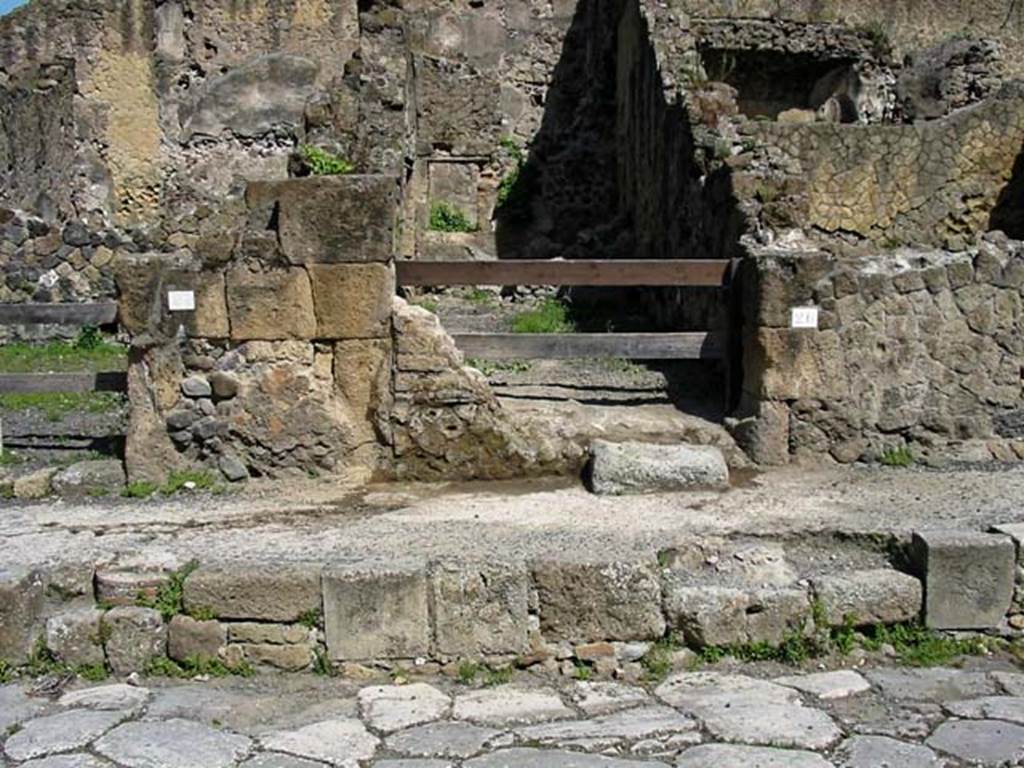 V.26, Herculaneum. May 2003. Looking west to entrance doorway on Cardo V. 
Photo courtesy of Nicolas Monteix.
