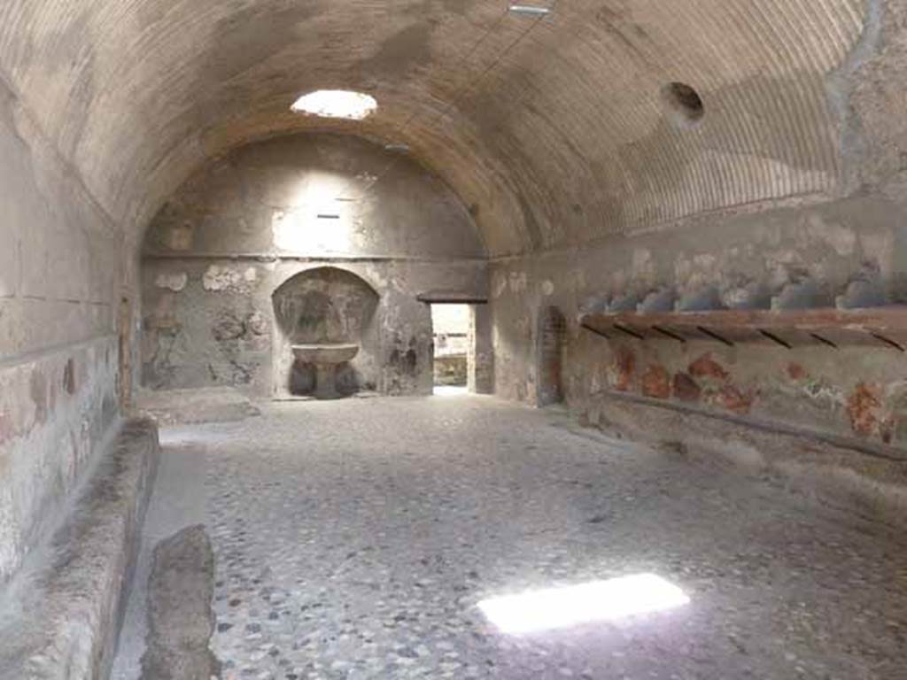 Ins. VI.1/7. May 2010. Changing/dressing room, or apodyterium of the men’s baths. 
Looking north from entrance doorway across floor of segmented black, grey and white marble.
