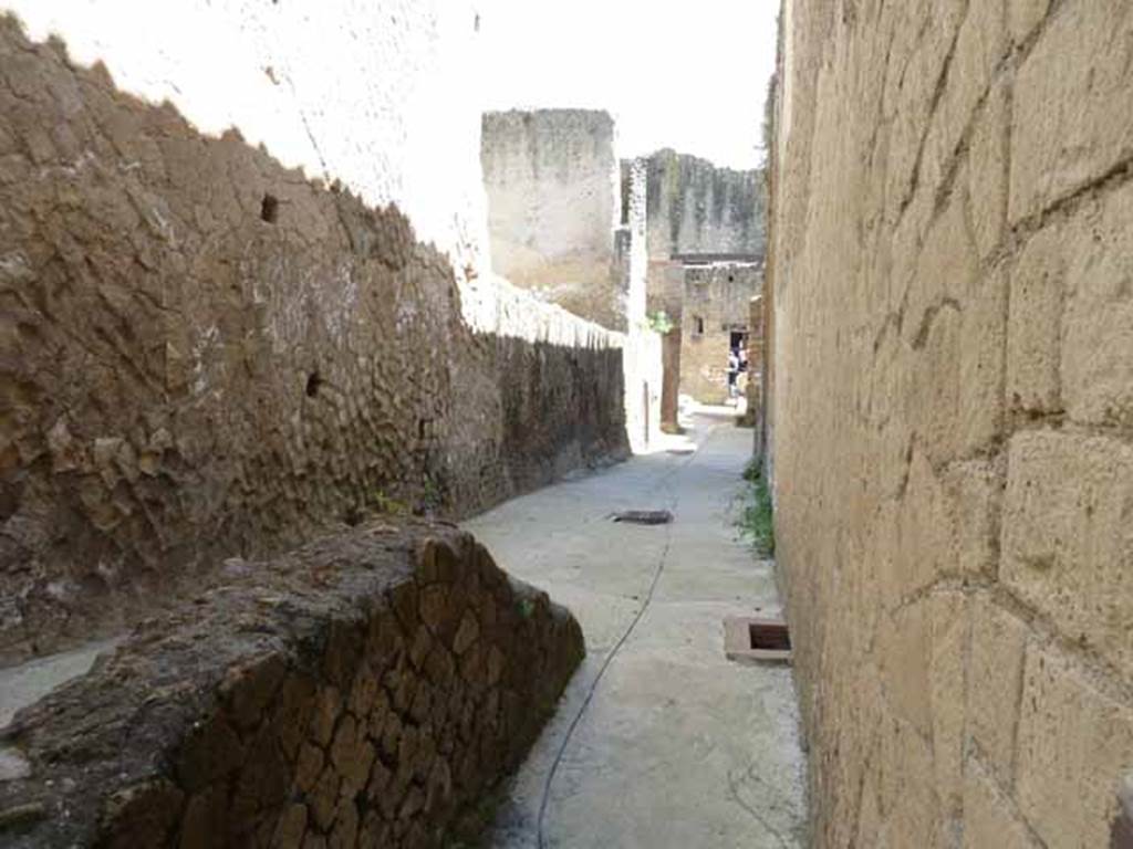 VI.1/7. May 2010. Looking east along rear corridor on north side of baths, leading towards furnace and well, and entrance at Ins. VI.10.