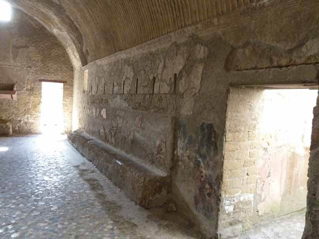 VI.1/7. May 2010. Dressing room or apodyterium.  Looking towards west wall, and north-west corner with doorway leading to cold plunge pool room, or frigidarium, on right.
