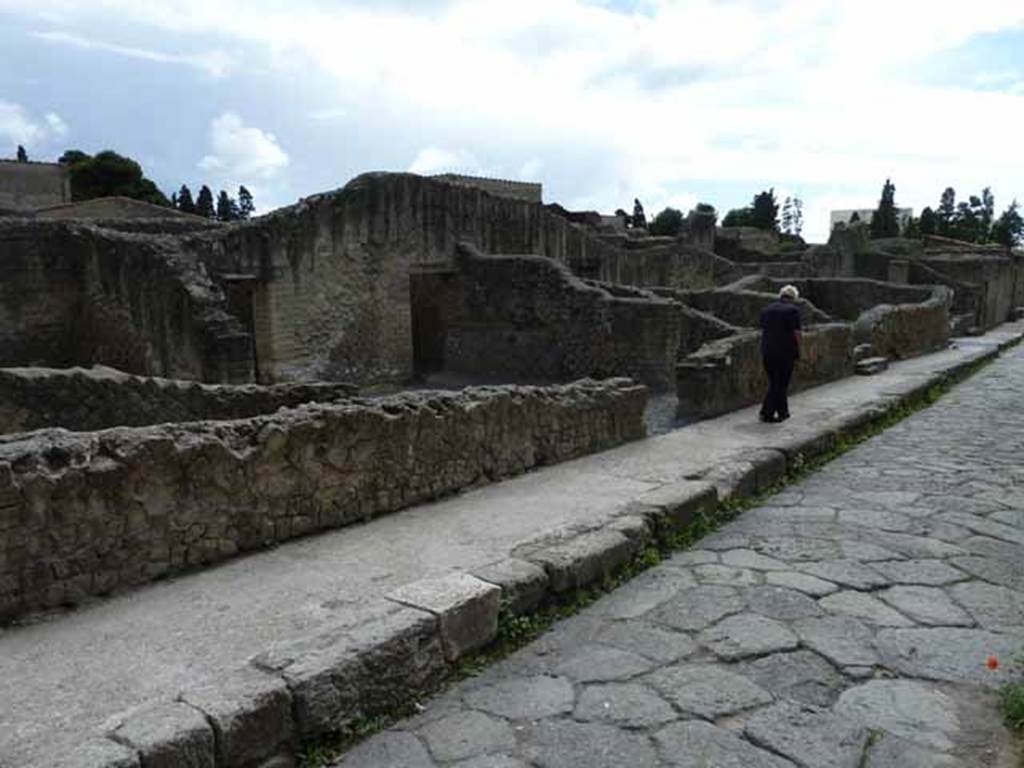 Ins.VI. Herculaneum, May 2010. Looking south-east along east side of Cardo III Superiore, with doorways VI.2 and VI.3, leading into small hospitium.
