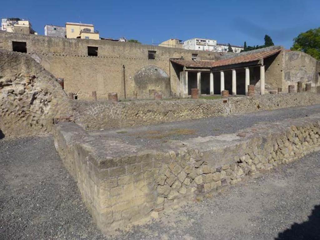 VI.1/4/5, Herculaneum, June 2012. Looking north-east from Decumanus Inferiore across open-exercise area of Baths.  Photo courtesy of Michael Binns.
