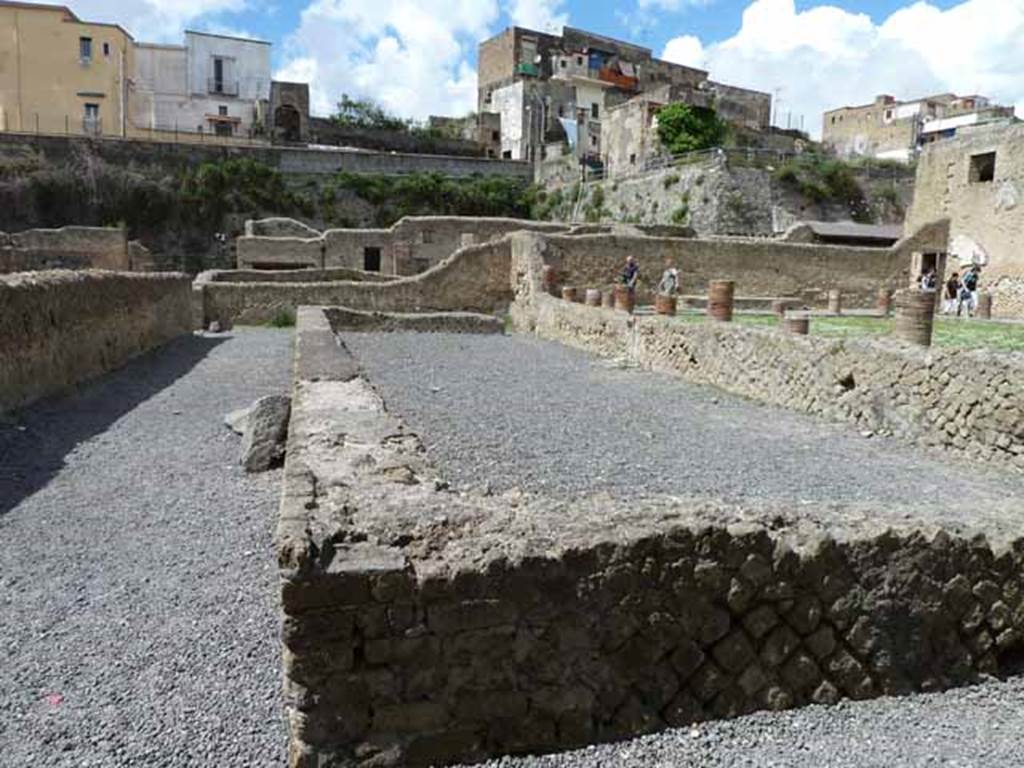 Ins. VI.5. May 2010. Looking west along open exercise area, at front of palaestra with columned portico. 