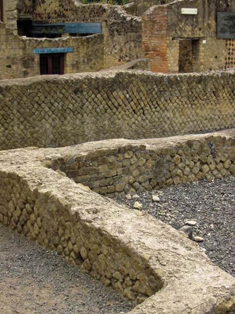 VI.5, Herculaneum. May 2003. 
Looking south across open exercise area towards Decumanus Inferiore, and doorways of Ins. III.
Photo courtesy of Nicolas Monteix.


