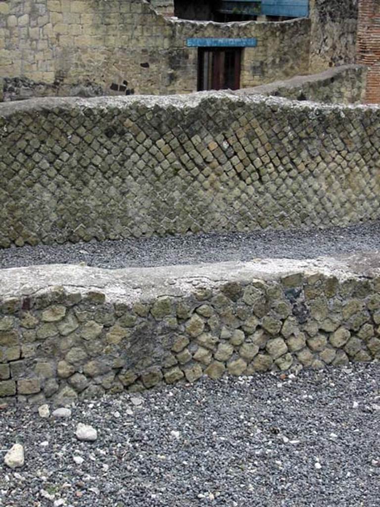 VI.5, Herculaneum. May 2003. 
Looking south across open exercise area towards Decumanus Inferiore, and doorway of Ins. III.8.
Photo courtesy of Nicolas Monteix.
