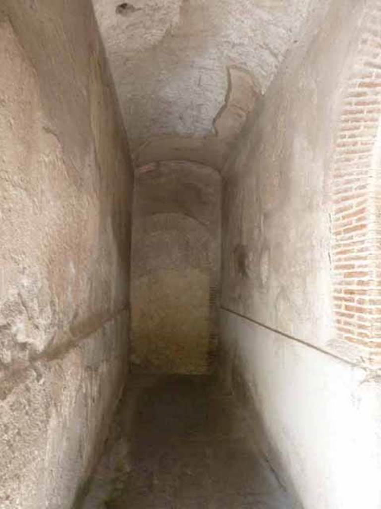 VI.8, Herculaneum. May 2010. Looking west along corridor, on the south side of the waiting room. 