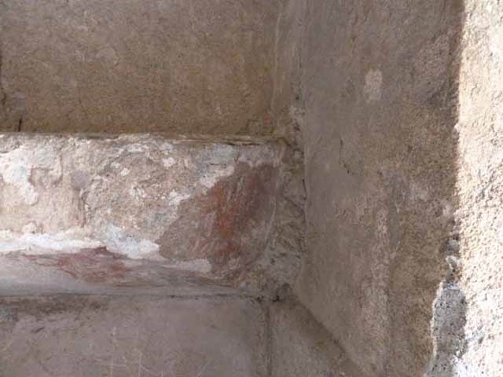 VI.8, Herculaneum. May 2010. Shelving with painted surface, at south end of east wall.