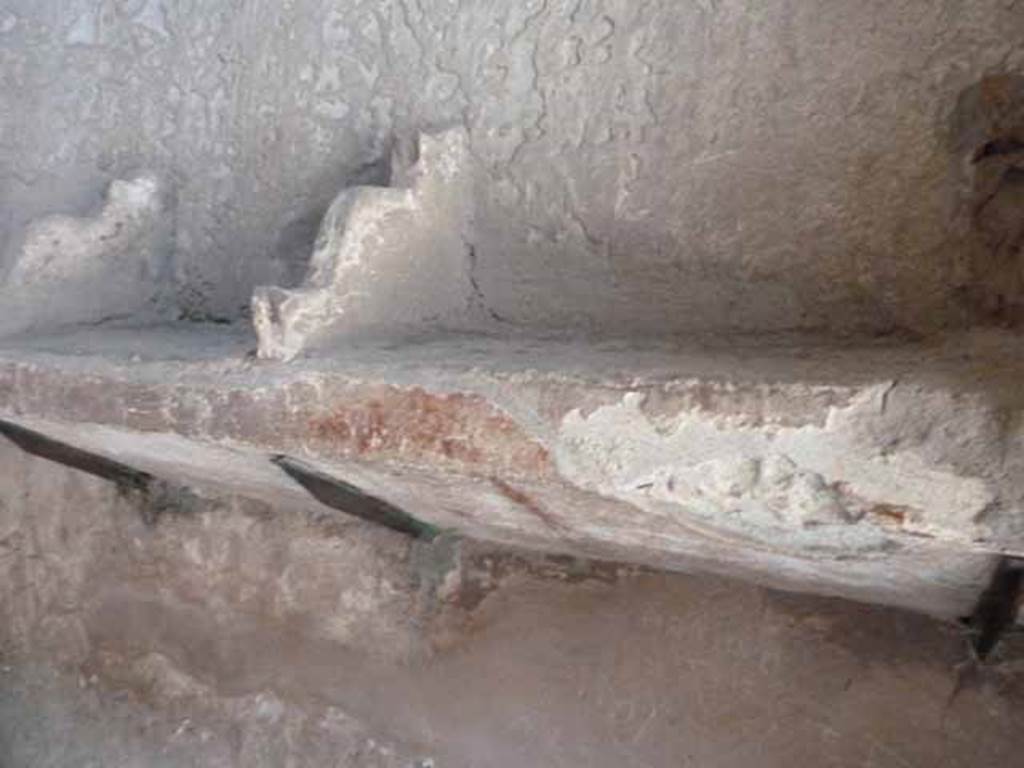 VI.8, Herculaneum. May 2010. Detail of shelving for clothing and articles in east wall of apodyterium.