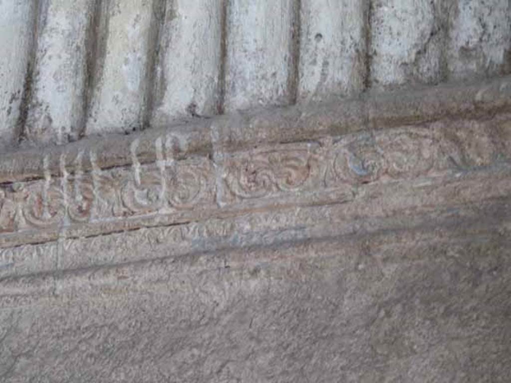 VI.8, Herculaneum. May 2010. Detail of decorative stucco on east wall.

