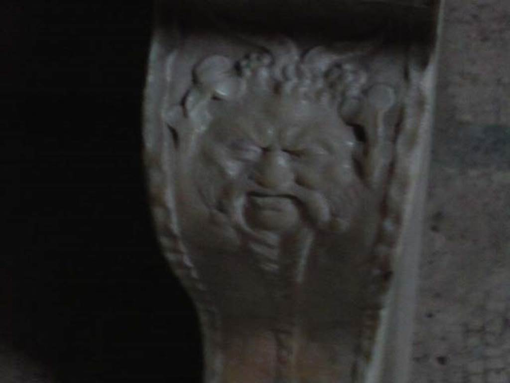 VI.8, Herculaneum. August 2013. Detail of face on leg of marble bench on east side.
Photo courtesy of Buzz Ferebee.
