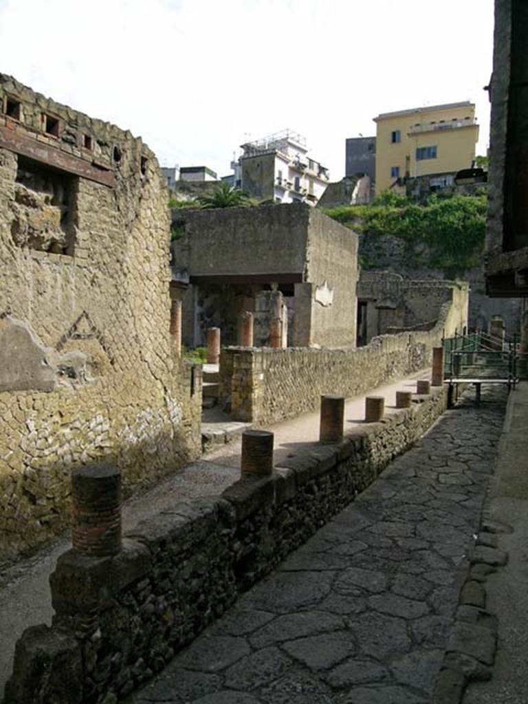 VI.11, Herculaneum. May 2004. Looking north-west on Cardo IV, towards entrance doorway. 
Photo courtesy of Nicolas Monteix.

