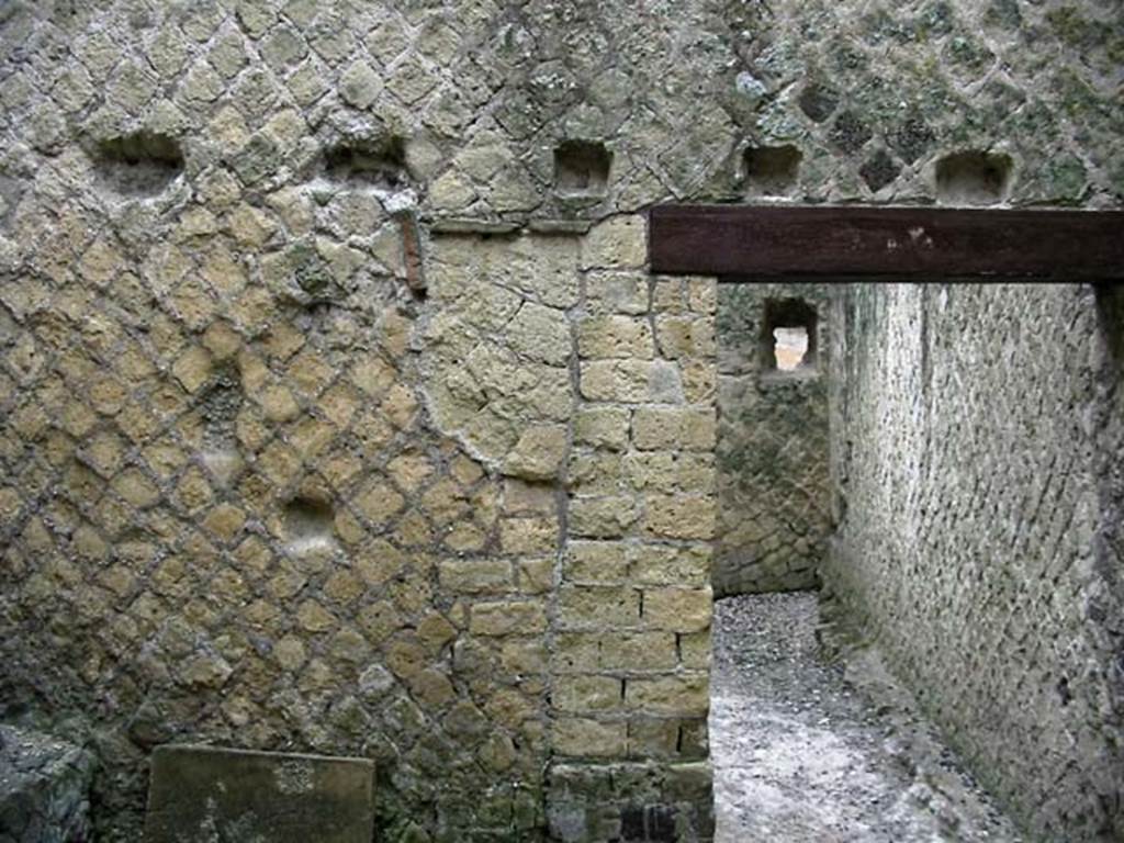 VI.13/11, Herculaneum. May 2003. Looking east in rustic storeroom, with doorway to kitchen. 
Photo courtesy of Nicolas Monteix.
