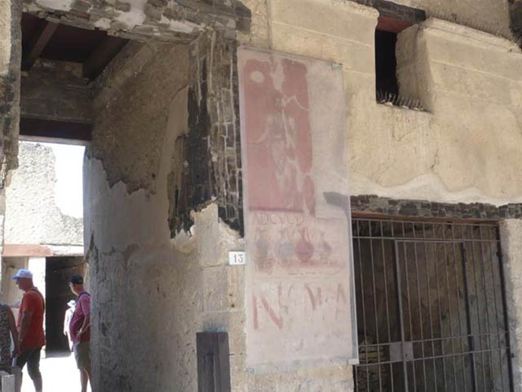 VI.13 Herculaneum. August 2013. Detail from right (west) side of entrance doorway, (see also VI.14).
Photo courtesy of Buzz Ferebee.

