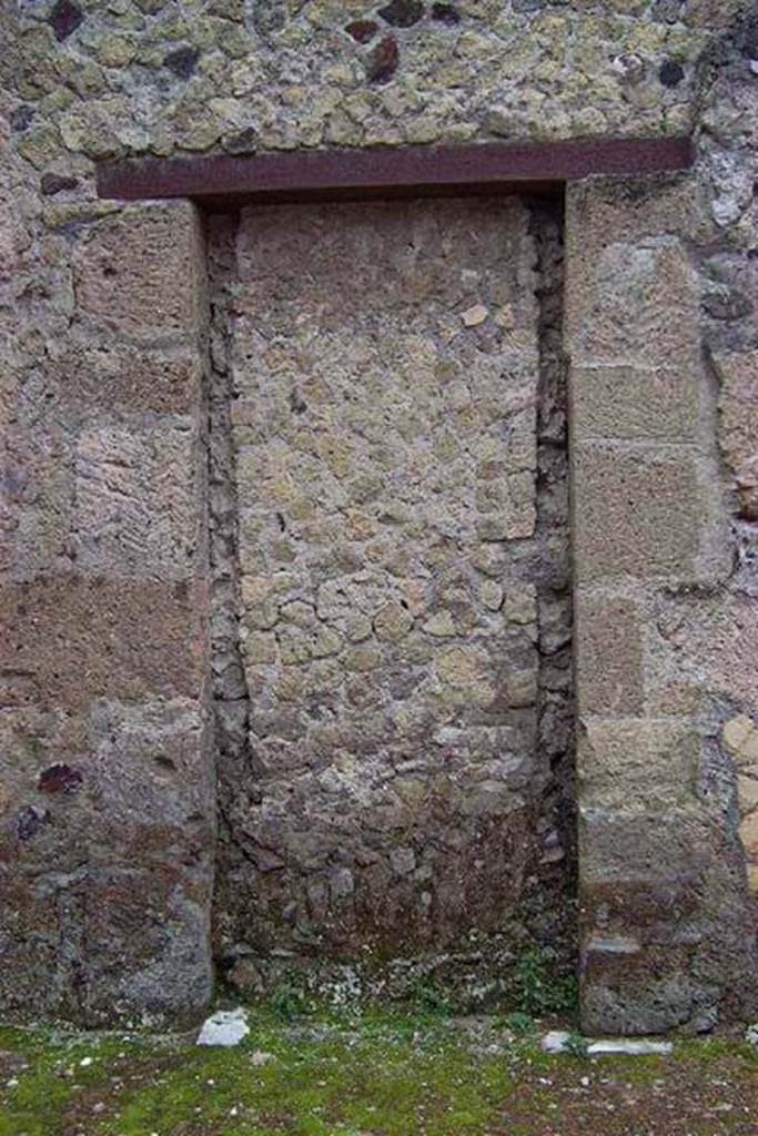 VI.13/11, Herculaneum. Not dated. 
Looking towards blocked doorway in north wall of atrium, whch would have led into the shop-room of VI.14.
Photo courtesy of Nicolas Monteix.
