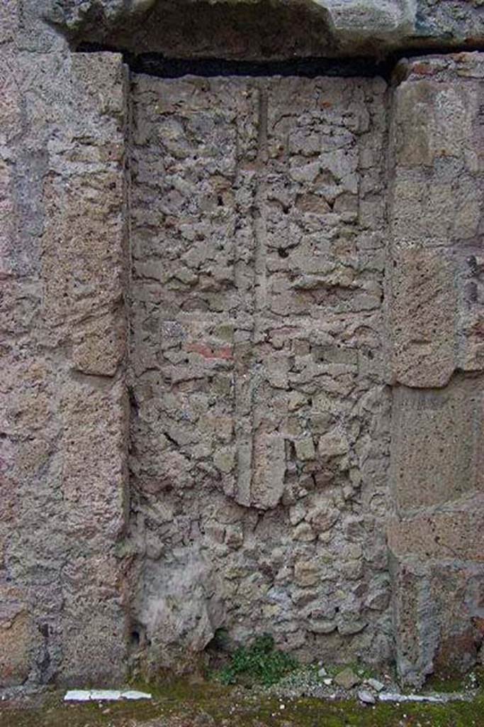 VI.13/11, Herculaneum. Not dated. Looking towards blocked doorway in north wall in north-east corner.
This blocked doorway would have led into the shop-room of VI.12. Photo courtesy of Nicolas Monteix.
