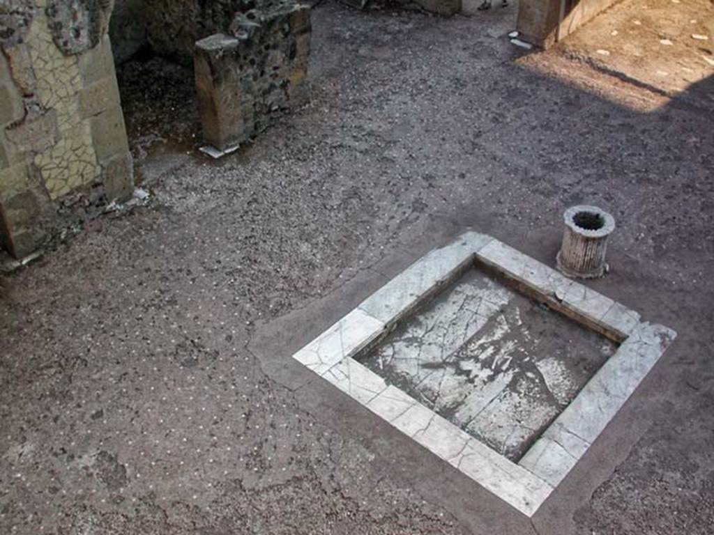 VI.13/11 Herculaneum. September 2003. 
Atrium, looking towards doorway to cubiculum in centre of east side, upper left. Photo courtesy of Nicolas Monteix.

