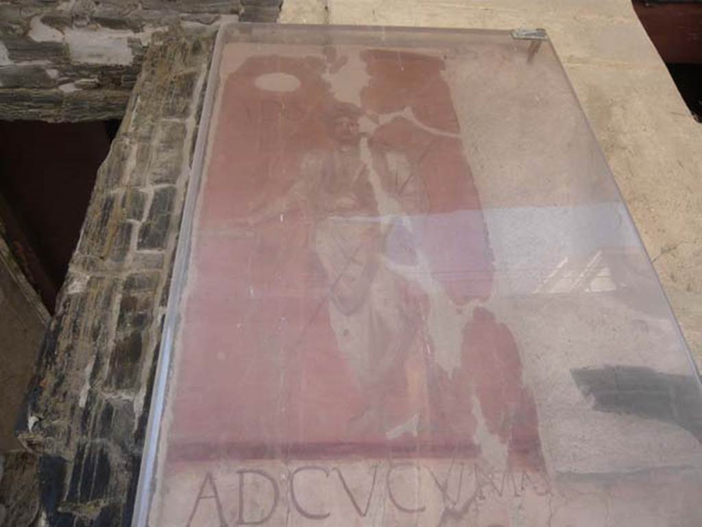 Ins. VI 14, Herculaneum, August 2013.  Painted figure at the top of the pilaster on the left of the entrance doorway. Photo courtesy of Buzz Ferebee.

