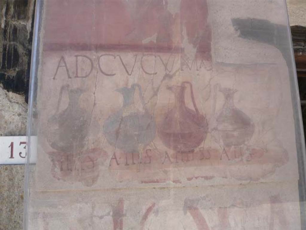 Ins. VI 14, Herculaneum, August 2013.   Detail from the painted pilaster on the left of the entrance doorway showing the painted pitchers.  Photo courtesy of Buzz Ferebee.
