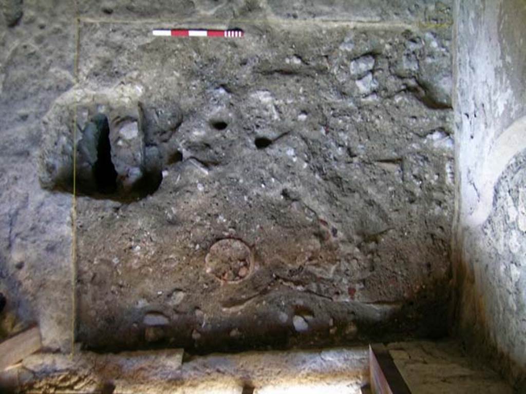 VI.15, Herculaneum. September 2004. Looking down on north-west corner near entrance doorway, lower.   
Photo courtesy of Nicolas Monteix.
