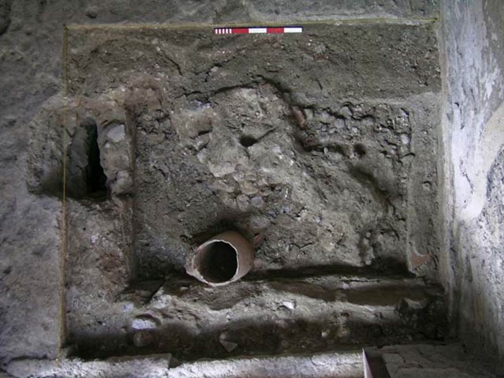 VI.15, Herculaneum. September 2004. Looking down on north-west corner near entrance doorway, lower.    
Photo courtesy of Nicolas Monteix.
