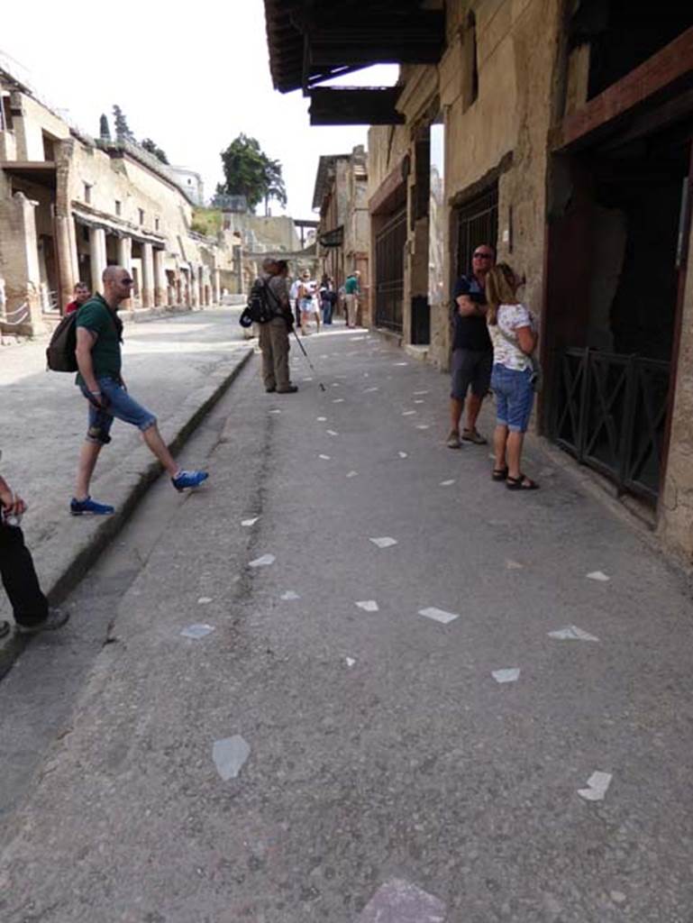 VI 15, Herculaneum, on right. October 2014. Looking east along the pavement with marble inserts on Decumanus Maximus. Photo courtesy of Michael Binns.


 
