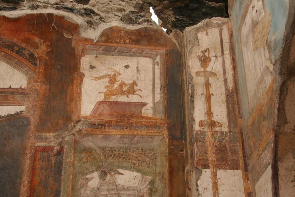 VI.21 Herculaneum. April 2013. Detail of painted decoration from south end of east wall.  
Photo courtesy of Klaus Heese.
