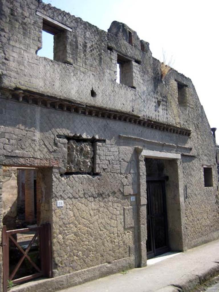 VI.28, on left, Herculaneum. July 2009. Entrance doorways, looking south towards VI.29 doorway. Photo courtesy of Sera Baker.
