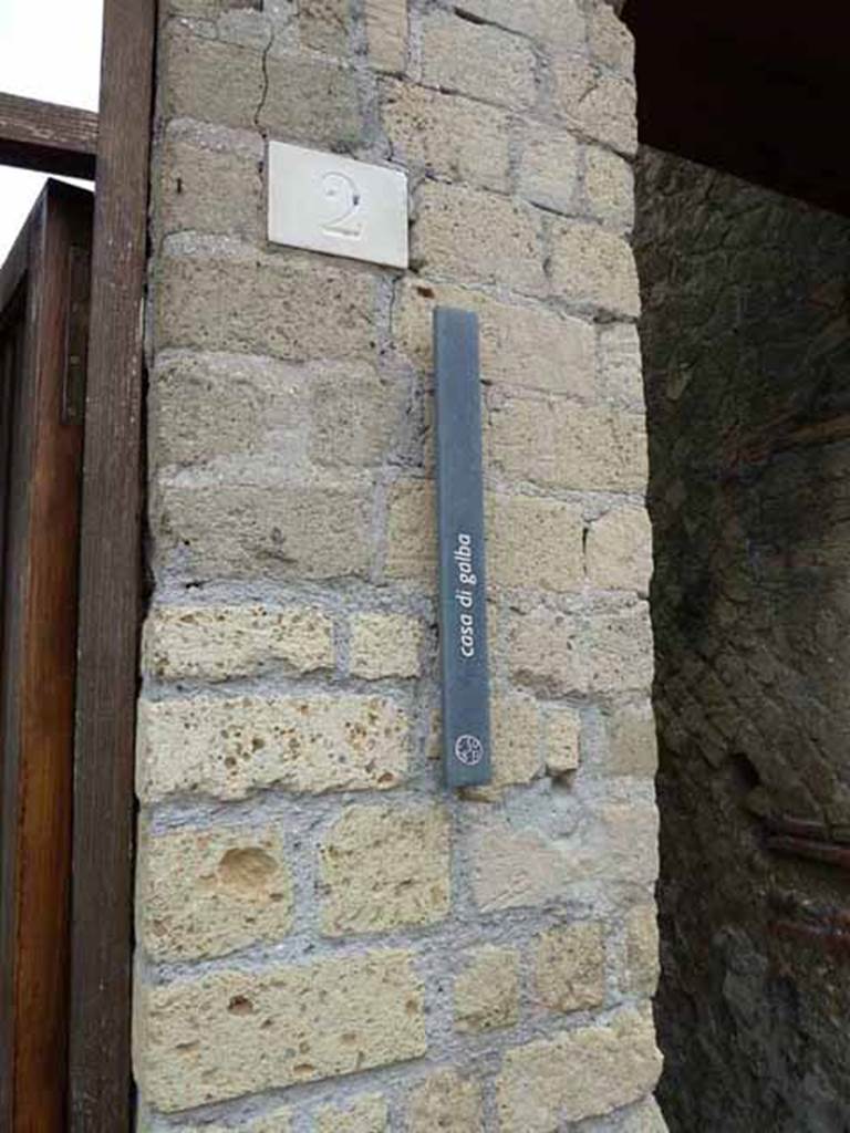 VII.2 Herculaneum. May 2010. Entrance doorway identification sign. 