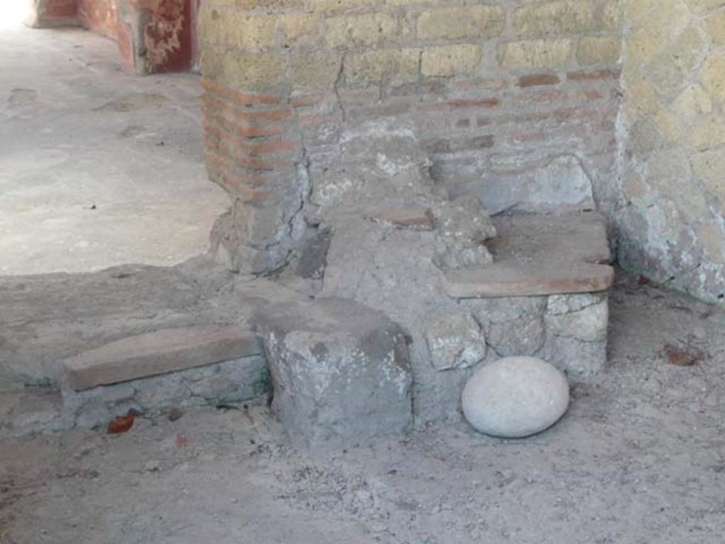 Ins. Orientalis I, 1, Herculaneum, August 2013. Doorway to atrium in east wall with remains of three masonry steps, which would have been topped by a wooden ladder leading to the upper rooms. Photo courtesy of Buzz Ferebee.
