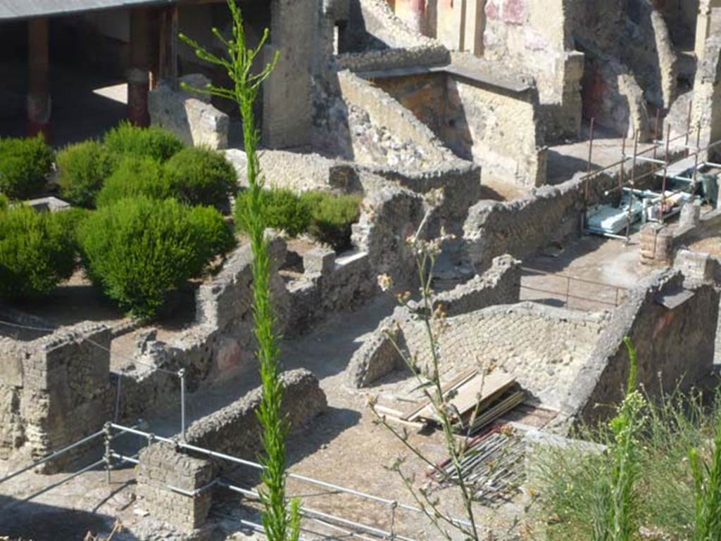 Ins. Orientalis I.1, and I.2 Herculaneum, August 2013. Looking north-west across rear rooms, from access roadway.
On the left is the garden for the House of the Gem. The corridor leading to the upper right, is part of the House of Telephus Relief, ins. Or. I.2. 
The rooms in the lower right would have been sumptuous living rooms, with views out over the terrace viridarium to the sea.
Photo courtesy of Buzz Ferebee.

