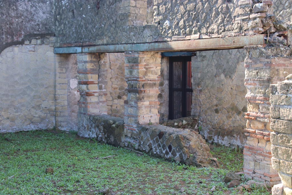 Ins. Orientalis I.3, Herculaneum, October 2022. 
Looking south-east towards area from a doorway in north wall of atrium of Ins.Or.I.2, leading into stables area. Photo courtesy of Klaus Heese.
