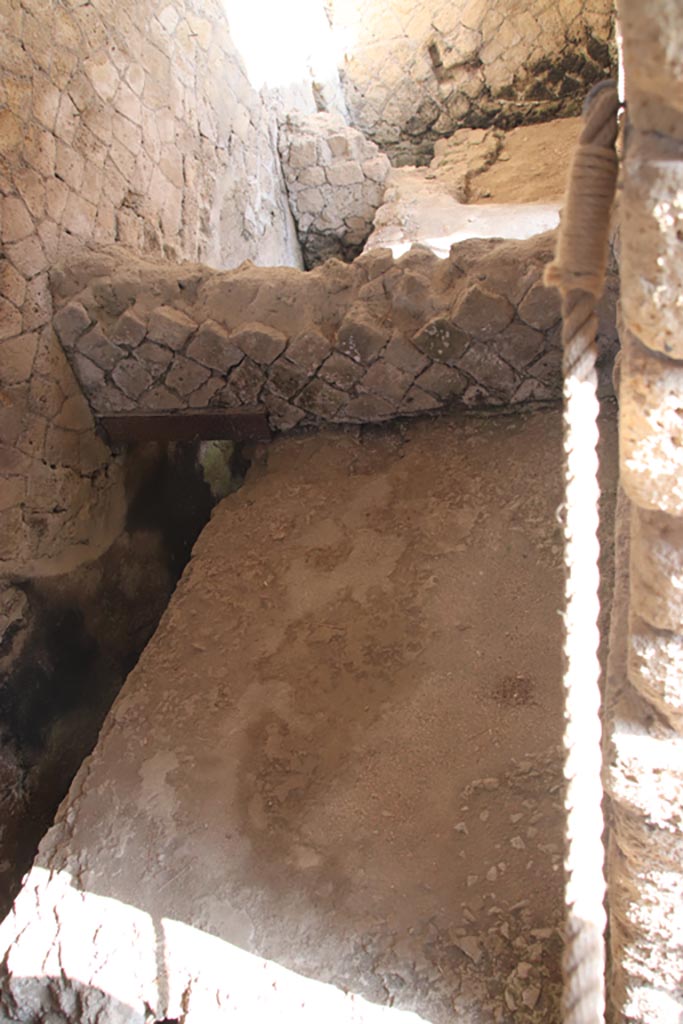 Ins. Or. II, 1a, Herculaneum. October 2023. 
Latrine c, looking north from doorway, across wall and into latrine c’. Photo courtesy of Klaus Heese.
