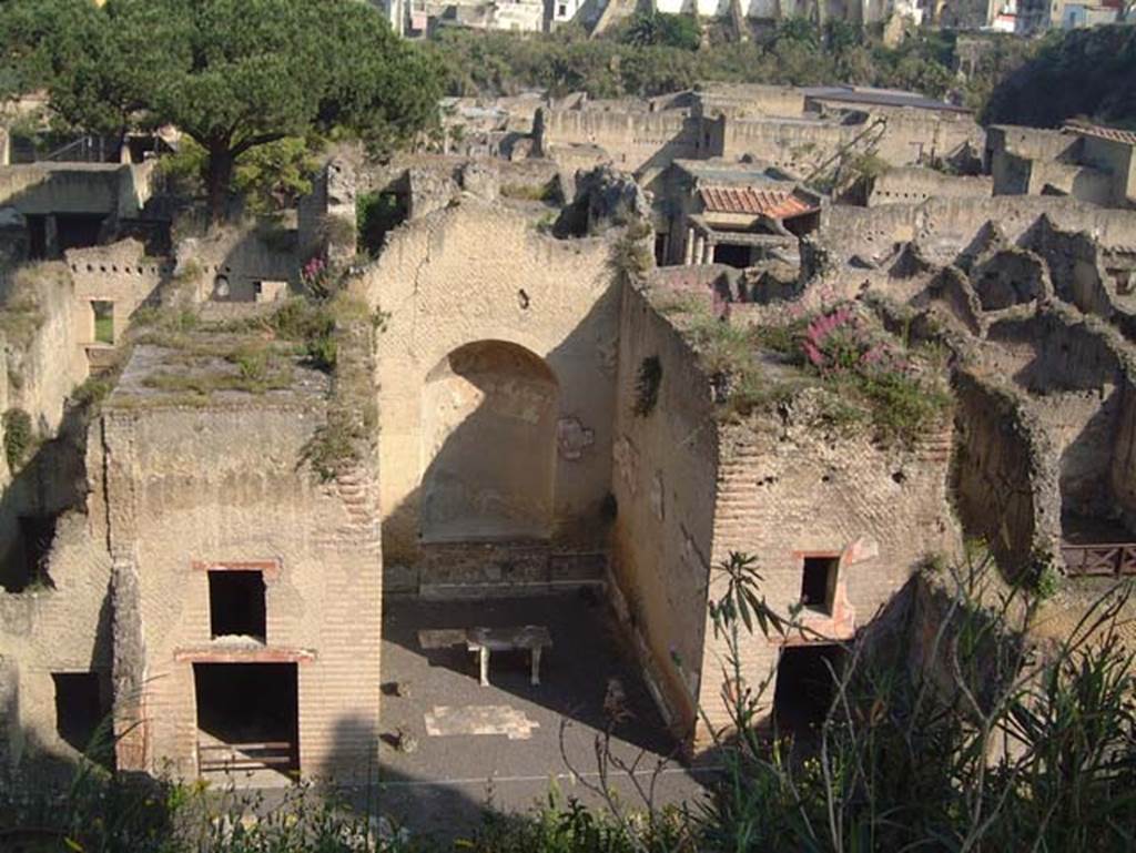 Ins. Orientalis II.4, Herculaneum, May 2001. 
Looking west towards the large apsed room, which opens out into the centre of the west portico, from roadway above.
The room on the north side of the large apsed room, on right of it, has the remaining decoration as photographed below.
Photo courtesy of Current Archaeology.

