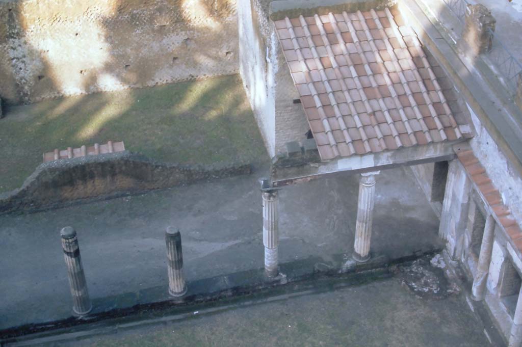 Ins. Orientalis II.4, Herculaneum, 4th December 1971. 
Looking down from access roadway, onto north-west corner of portico.
The rectangular area (grassed) has the remains of painted decoration under a tiled roof for protection, against the west side of the east wall.  
Photo courtesy of Rick Bauer, from Dr George Fay’s slides collection.

